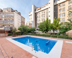 Swimming pool of Flat for sale in  Granada Capital  with Heating, Private garden and Parquet flooring