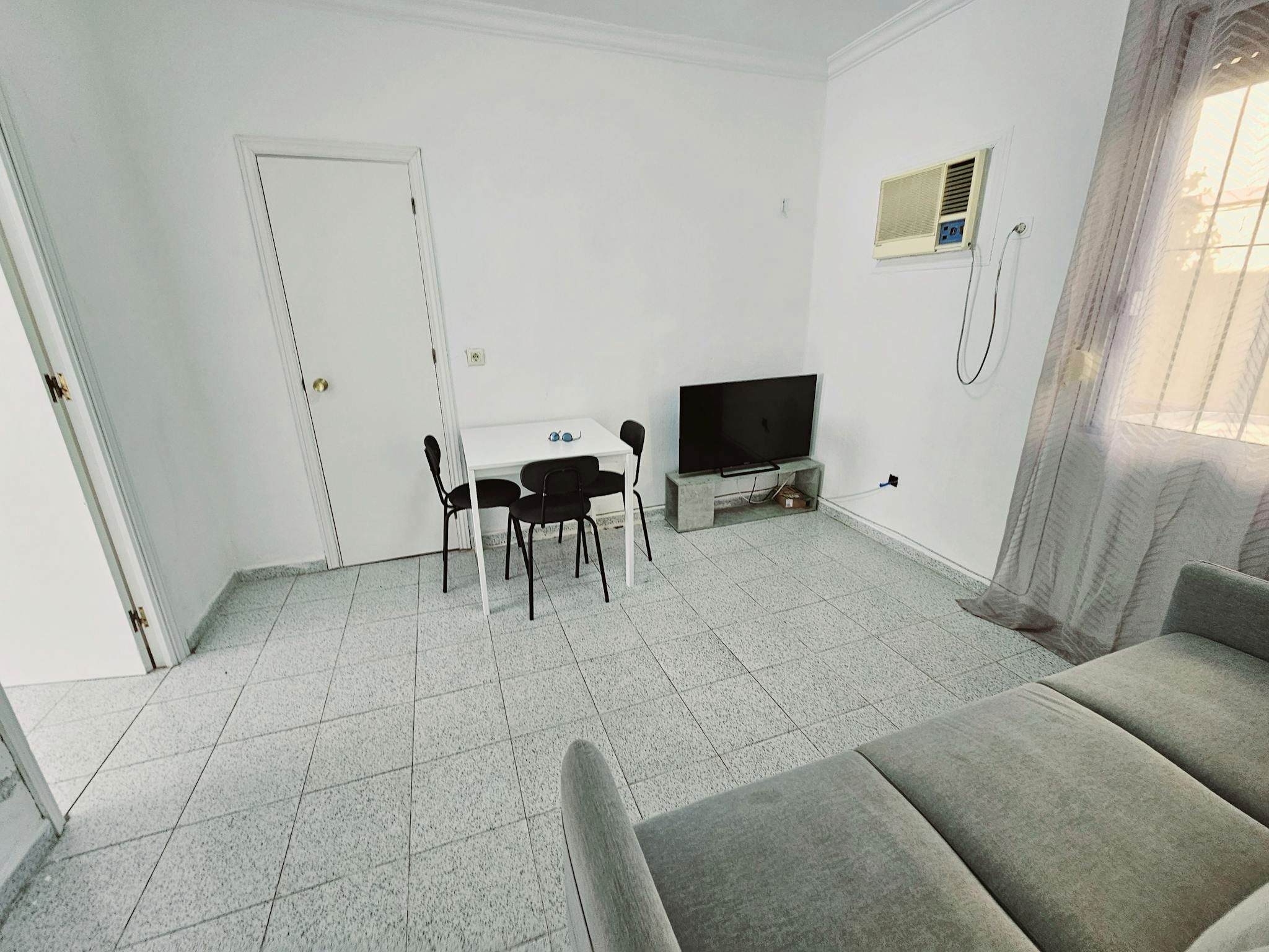 Sala d'estar de Pis per a compartir en  Sevilla Capital amb Aire condicionat, Moblat i Rentadora