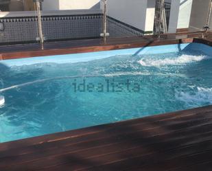 Swimming pool of Attic for sale in  Sevilla Capital  with Air Conditioner, Terrace and Swimming Pool