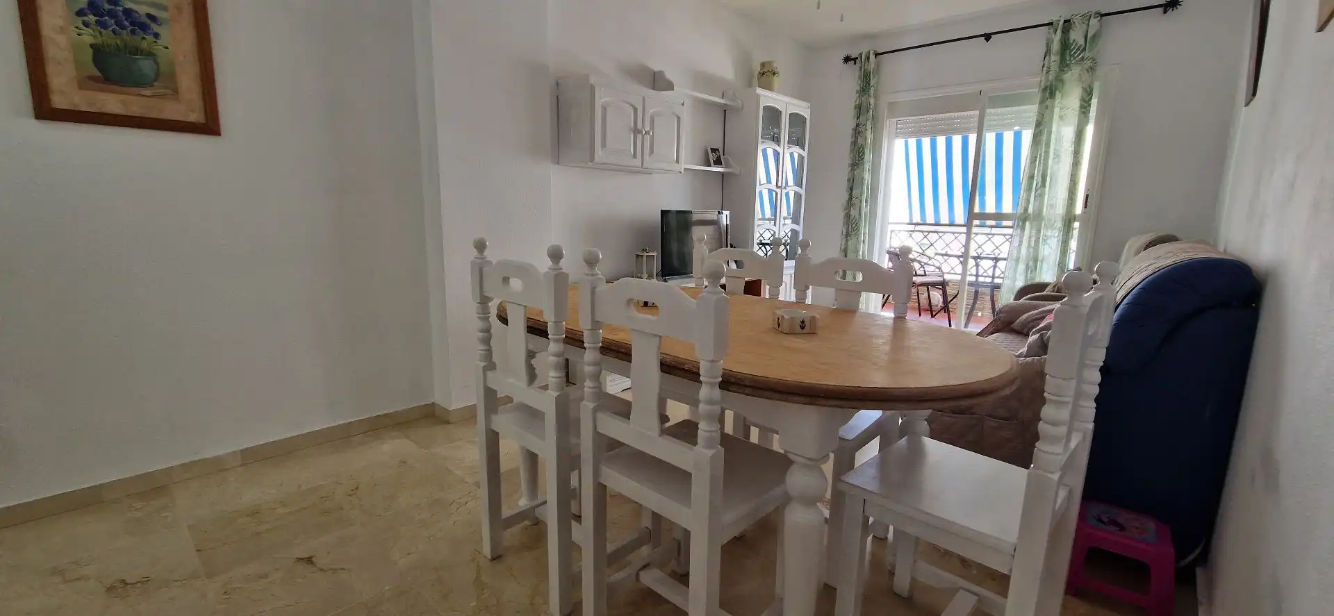 Menjador de Apartament de lloguer en El Portil amb Moblat i Piscina comunitària