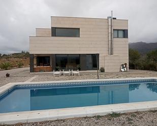 Vista exterior de Casa o xalet en venda en Busot amb Aire condicionat, Terrassa i Piscina