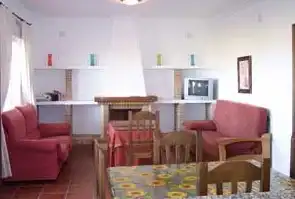Wohnzimmer von Einfamilien-Reihenhaus zur Miete in Conil de la Frontera mit Klimaanlage, Privatgarten und Schwimmbad