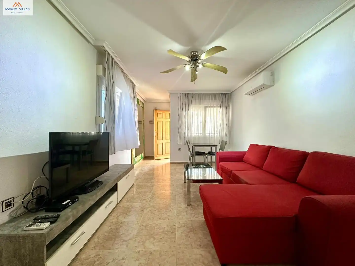 Sala d'estar de Planta baixa en venda en Orihuela amb Aire condicionat, Jardí privat i Piscina comunitària