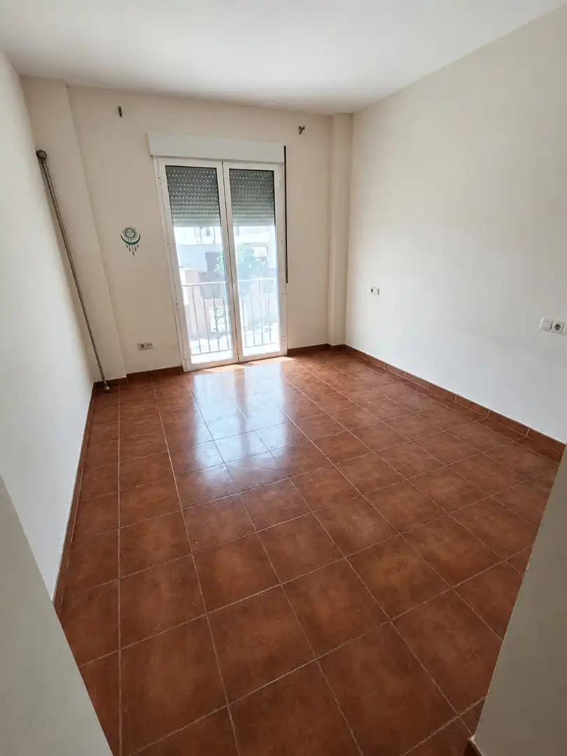 Sala de estar de Casa adosada en venta en La Carlota con Aire acondicionado, Calefacción y Horno