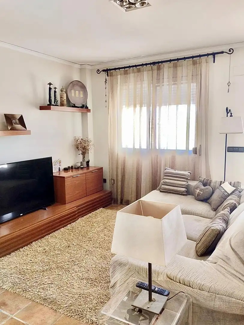 Sala d'estar de Casa adosada en venda en Cullera amb Aire condicionat, Calefacció i Jardí privat