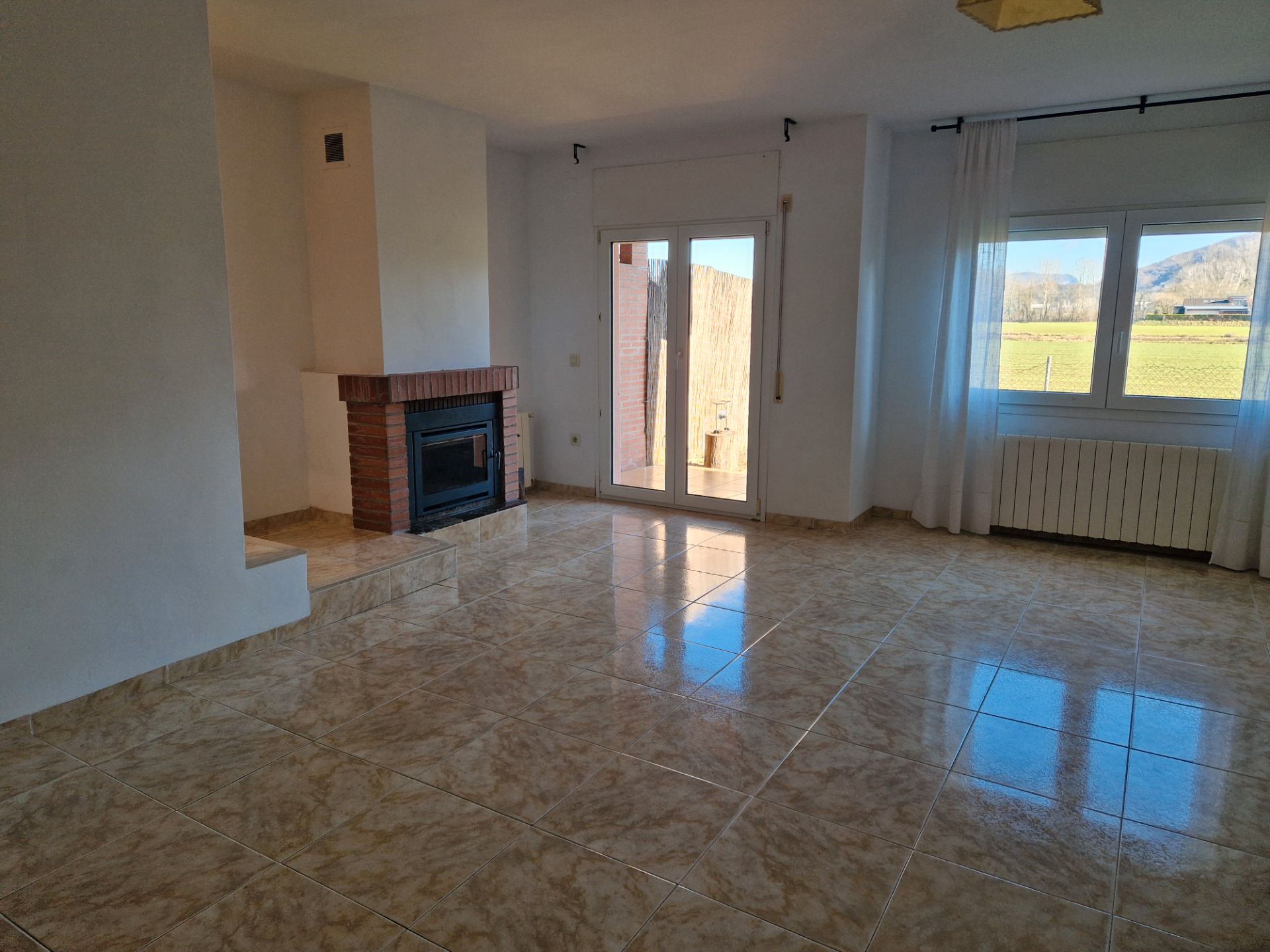 Living room of Single-family semi-detached for sale in La Vall d'en Bas  with Heating, Private garden and Terrace
