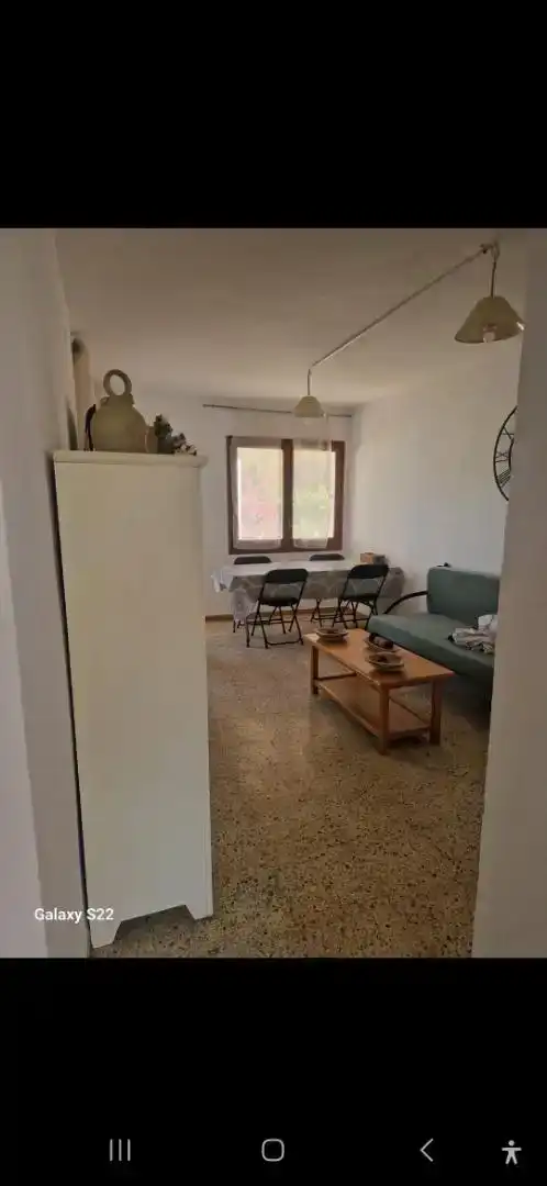 Sala d'estar de Casa adosada en venda en L'Ametlla de Mar  amb Aire condicionat, Jardí privat i Parquet