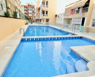 Swimming pool of Apartment for sale in Torrevieja  with Air Conditioner, Terrace and Community pool