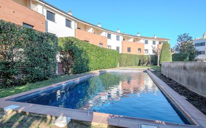 Swimming pool of Single-family semi-detached for sale in Cassà de la Selva  with Air Conditioner, Heating and Terrace