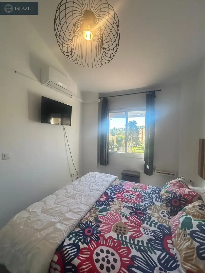 Dormitori de Apartament en venda en Isla Cristina amb Aire condicionat, Jardí privat i Terrassa