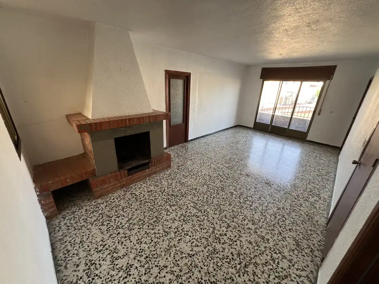 Sala d'estar de Casa adosada en venda en Guadix amb Traster i Balcó