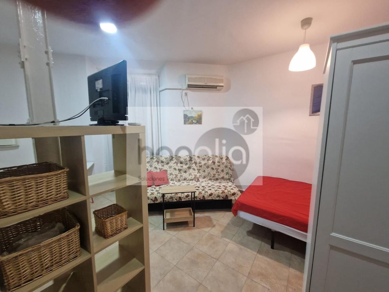 Sala d'estar de Estudi de lloguer en  Sevilla Capital amb Aire condicionat i Moblat