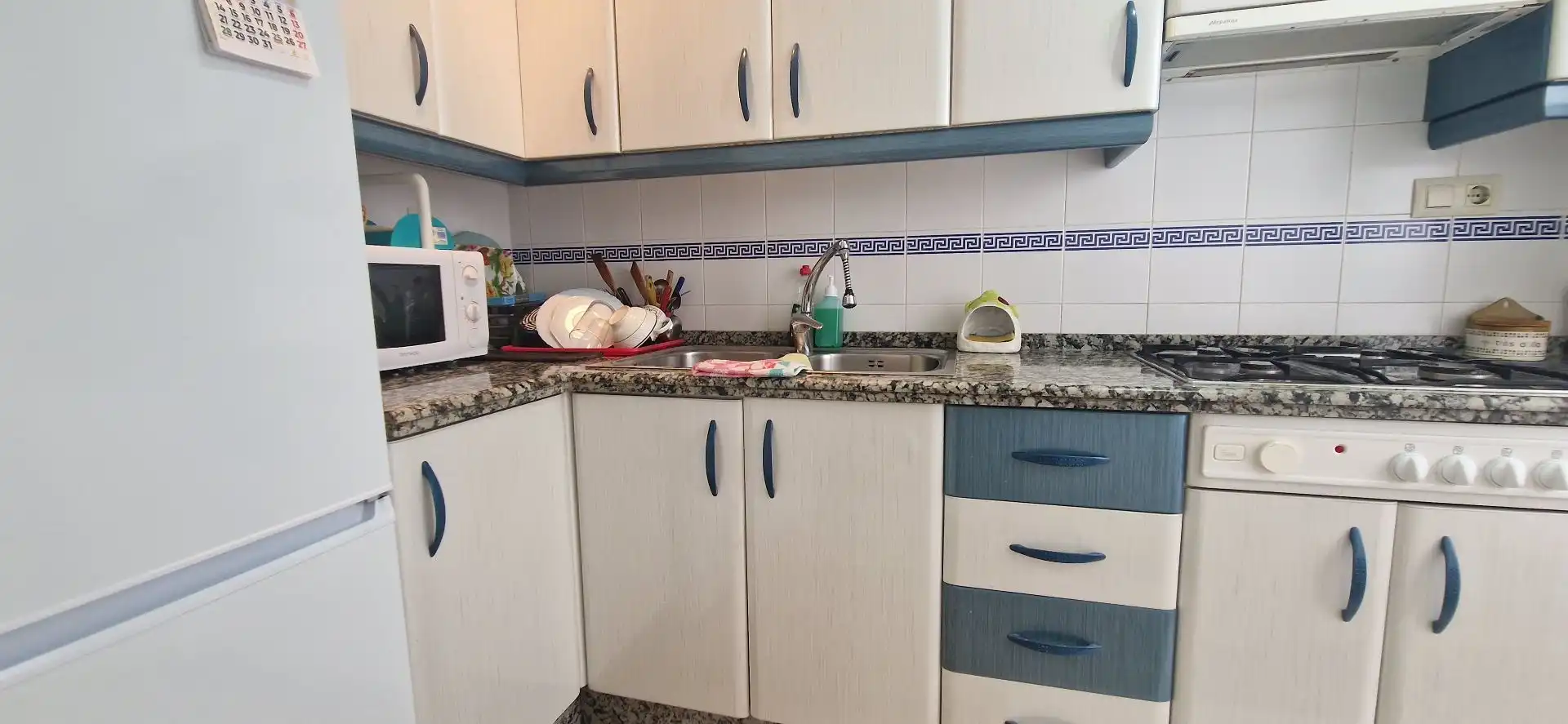Cuina de Apartament de lloguer en El Portil amb Moblat i Piscina comunitària