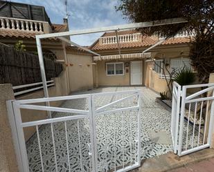 Exterior view of Single-family semi-detached for sale in Los Alcázares  with Air Conditioner, Terrace and Swimming Pool