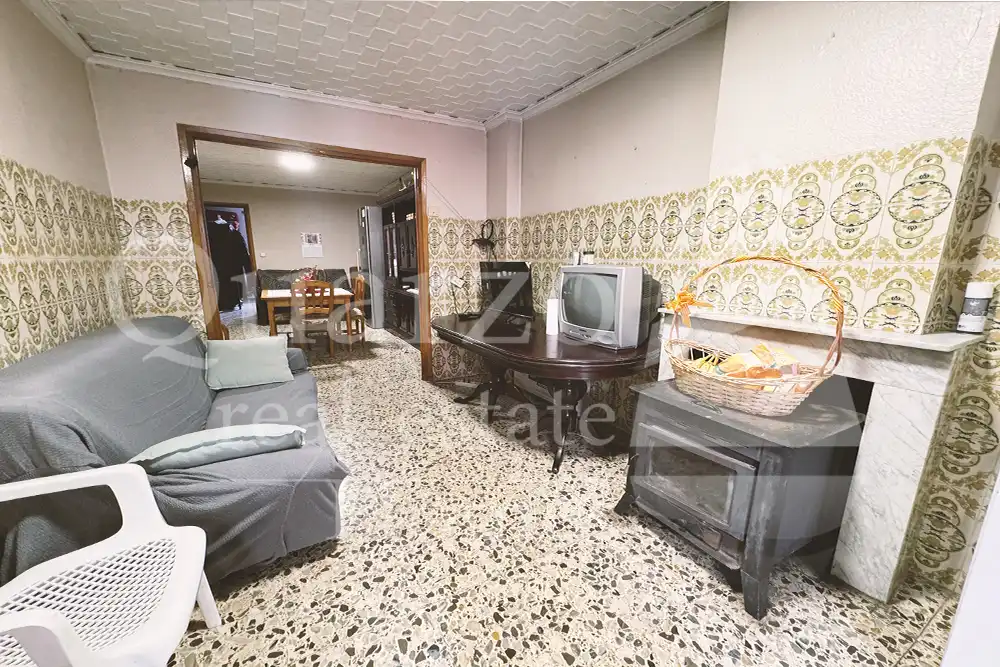 Sala d'estar de Casa adosada en venda en Real amb Traster i Moblat