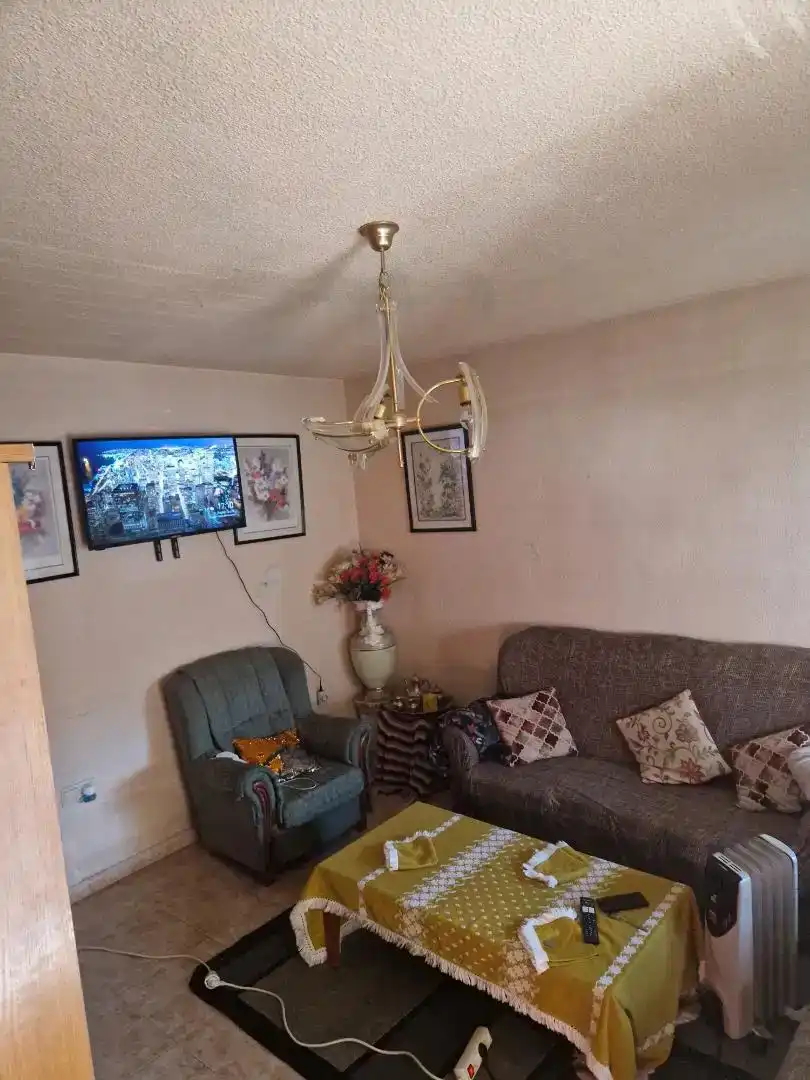 Sala d'estar de Casa adosada en venda en Atarfe amb Balcó