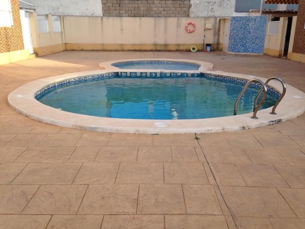Piscina de Casa adosada de lloguer en Cullera amb Aire condicionat, Terrassa i Traster