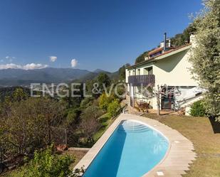 Vista exterior de Casa o xalet en venda en Sant Joan Les Fonts amb Aire condicionat, Jardí privat i Terrassa