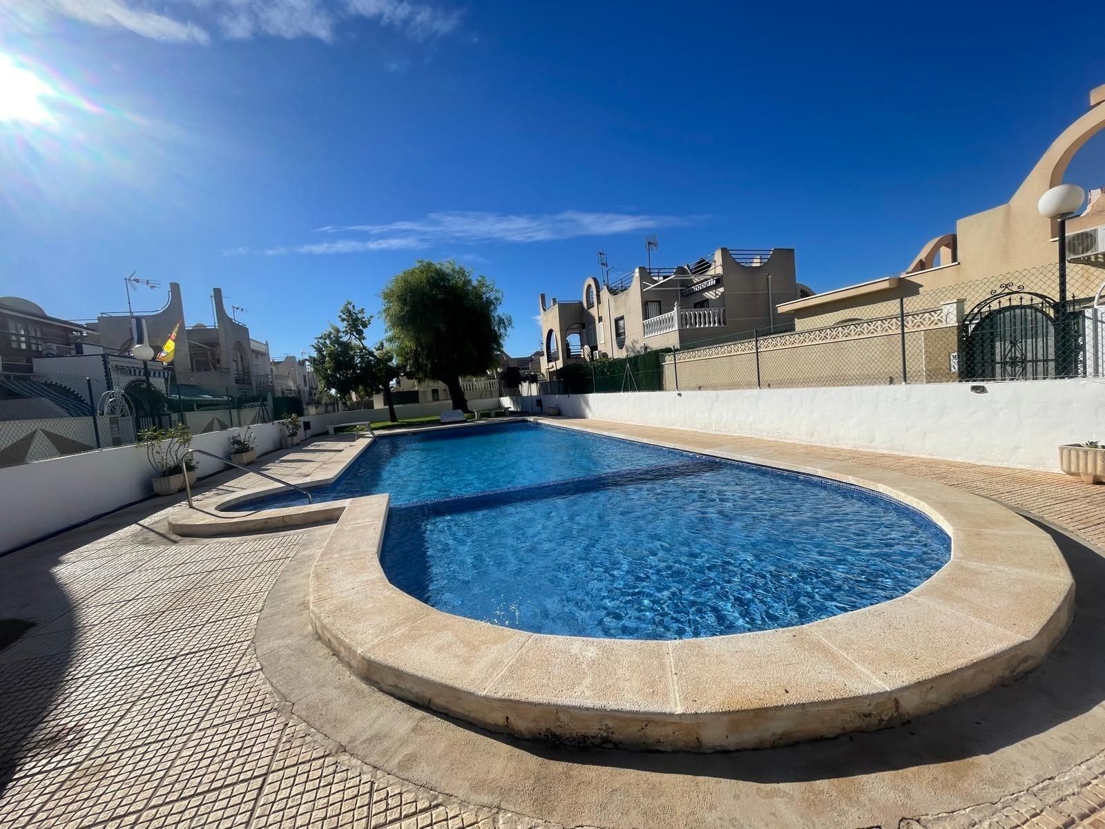 Swimming pool of Single-family semi-detached for sale in Torrevieja  with Air Conditioner, Heating and Terrace