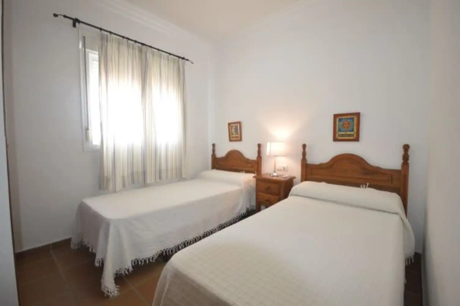 Habitación de Casa adosada de alquiler en Conil de la Frontera con Aire acondicionado, Jardín privado y Terraza