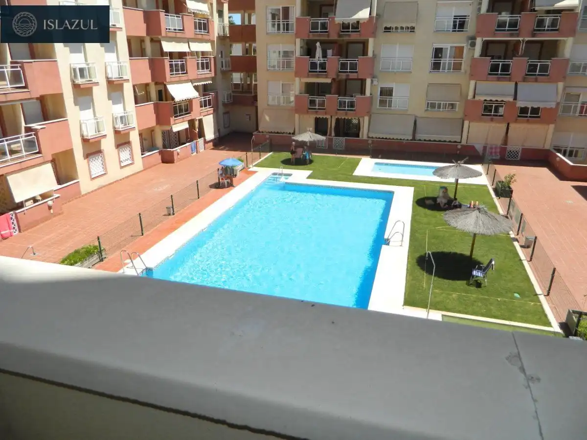 Piscina de Dúplex de alquiler en Isla Cristina con Terraza, Balcón y Piscina comunitaria