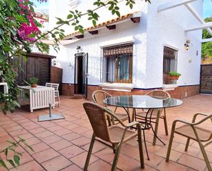 Jardí de Casa adosada de lloguer en El Portil amb Terrassa i Balcó