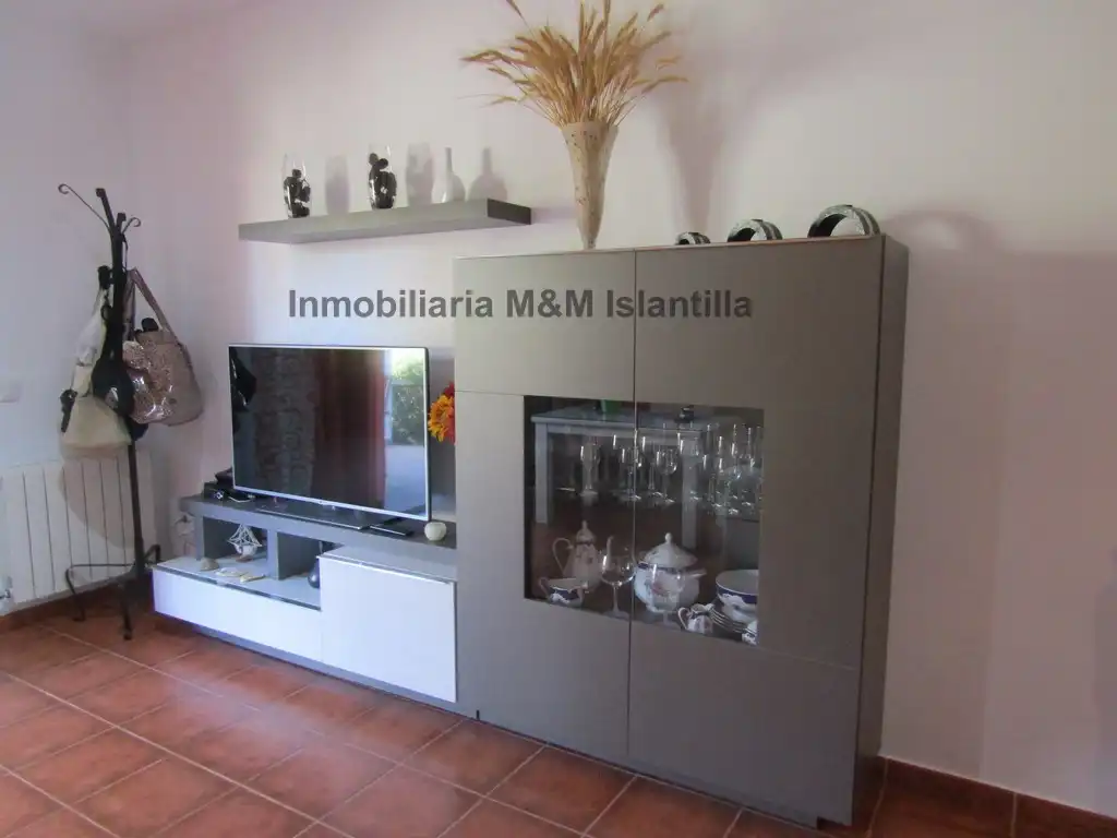Sala de estar de Casa adosada en venta en Islantilla con Jardín privado, Terraza y Amueblado