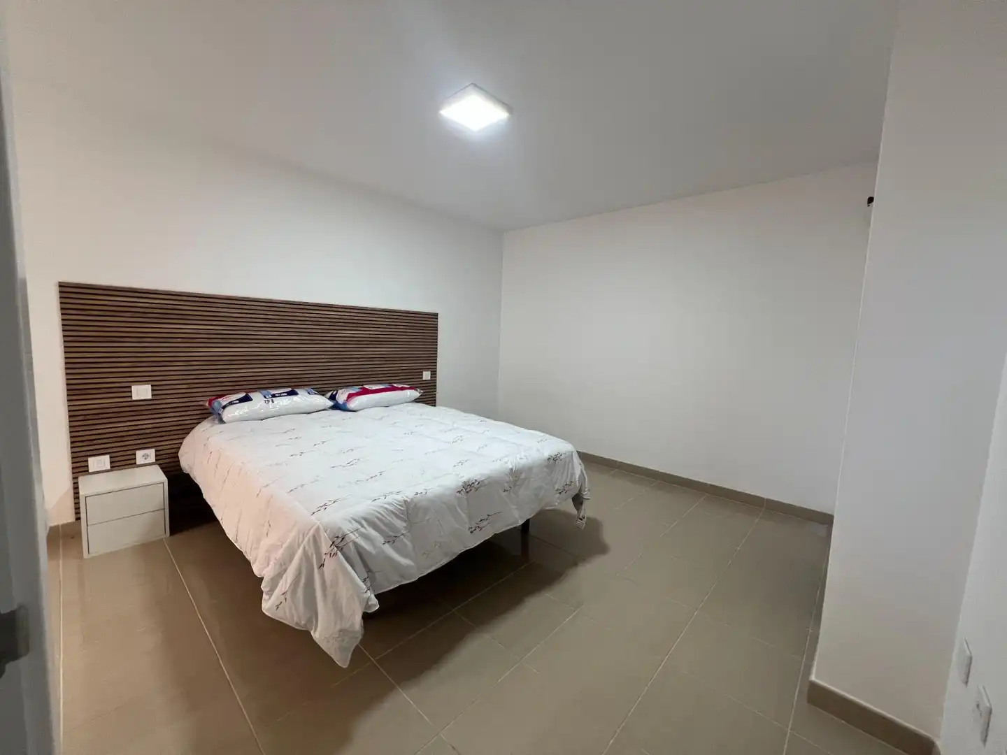 Schlafzimmer von Wohnungen zum Verkauf in Mogán mit Klimaanlage, Privatgarten und Terrasse