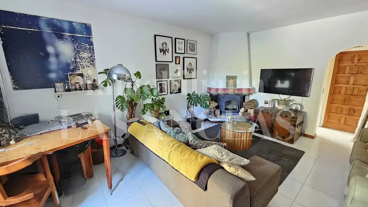 Sala de estar de Casa adosada en venta en Santa Eulària des Riu con Aire acondicionado, Jardín privado y Terraza