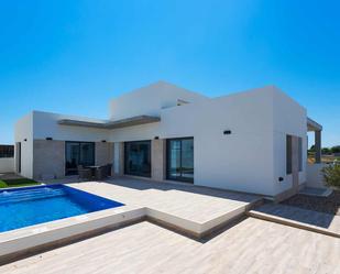 Exterior view of Single-family semi-detached for sale in Daya Nueva  with Private garden, Terrace and Swimming Pool