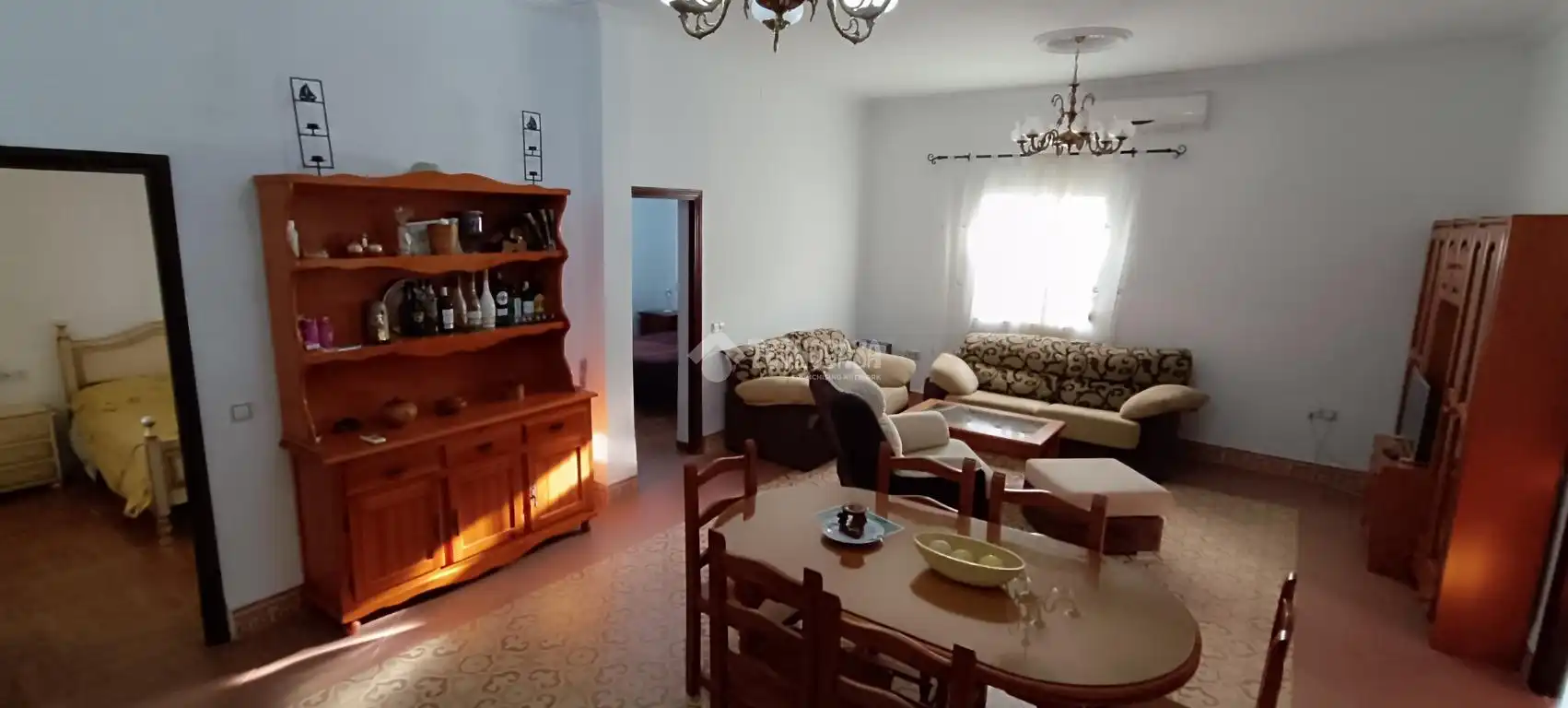 Sala d'estar de Finca rústica en venda en Dos Hermanas amb Aire condicionat, Terrassa i Piscina