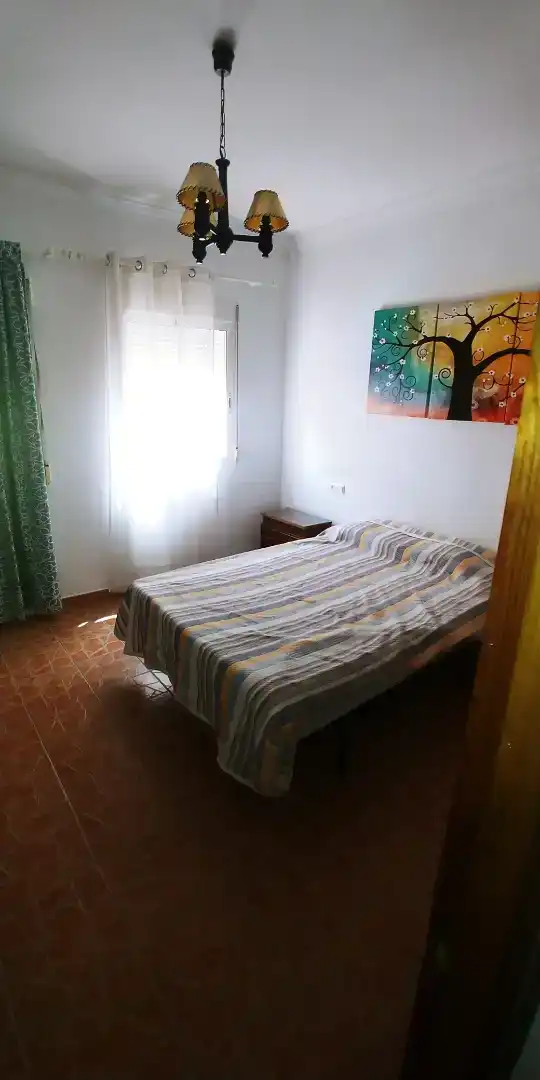 Dormitori de Casa adosada de lloguer en Cuevas del Becerro amb Aire condicionat, Moblat i Rentadora