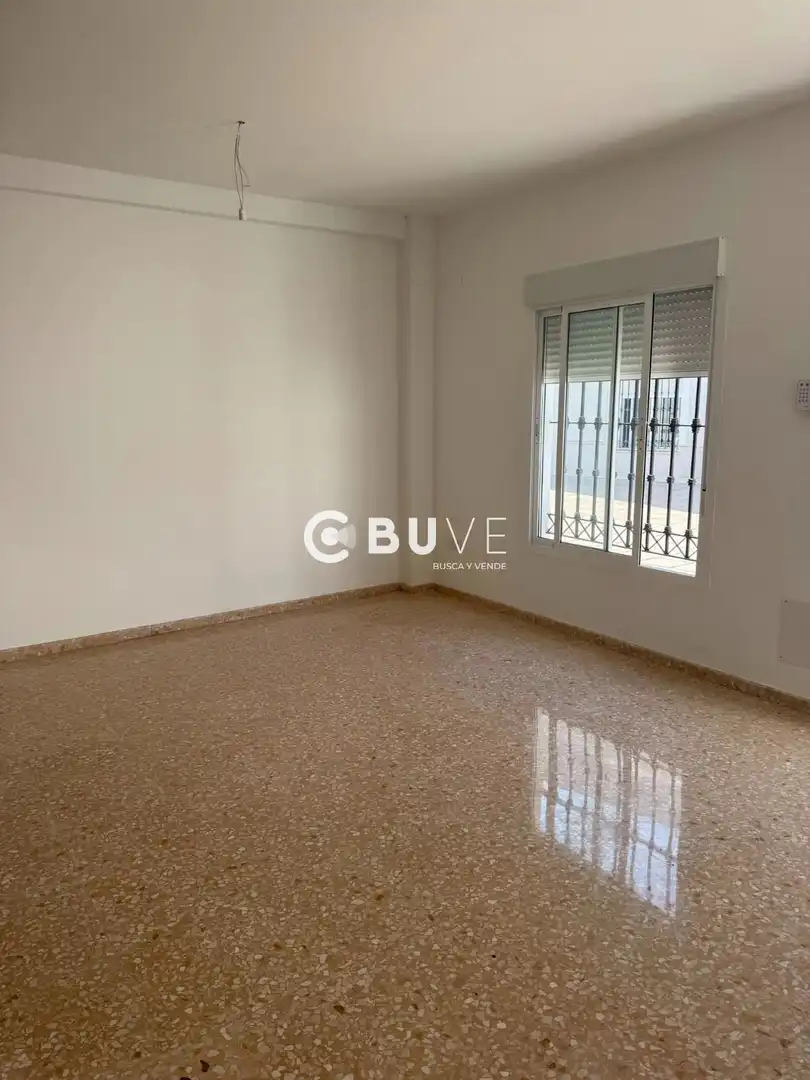 Sala de estar de Casa adosada en venta en Almonte con Terraza