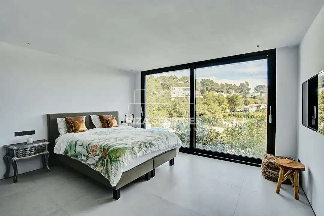 Dormitori de Casa o xalet de lloguer en Santa Eulària des Riu amb Aire condicionat, Jardí privat i Piscina