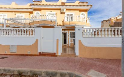 Exterior view of Single-family semi-detached for sale in Guardamar del Segura  with Air Conditioner and Swimming Pool