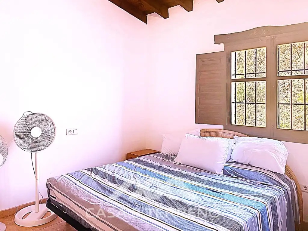 Dormitori de Casa o xalet de lloguer en Almáchar amb Aire condicionat, Terrassa i Rentadora