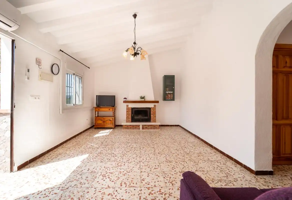 Sala de estar de Casa adosada en venta en Frigiliana con Aire acondicionado, Calefacción y Jardín privado