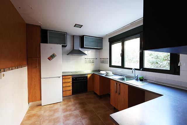 Cuina de Casa o xalet en venda en Manzanares El Real amb Calefacció i Jardí privat