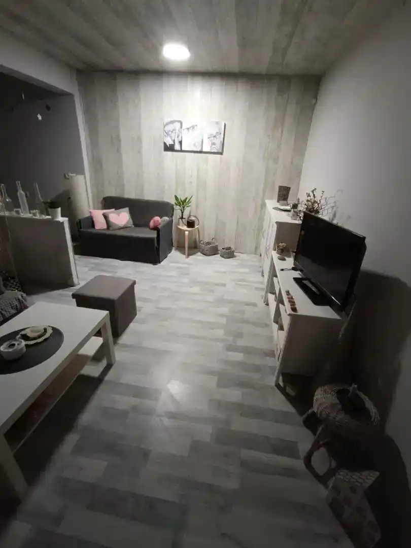 Sala d'estar de Casa adosada en venda en Escatrón amb Aire condicionat, Jardí privat i Moblat