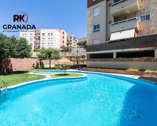 Swimming pool of Attic for sale in  Granada Capital  with Heating, Terrace and Storage room