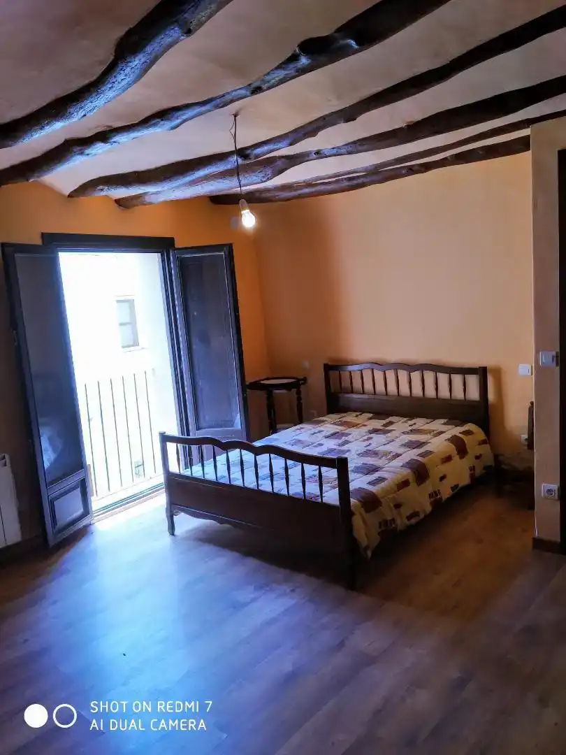 Dormitori de Casa adosada en venda en Castellote amb Parquet, Traster i Moblat