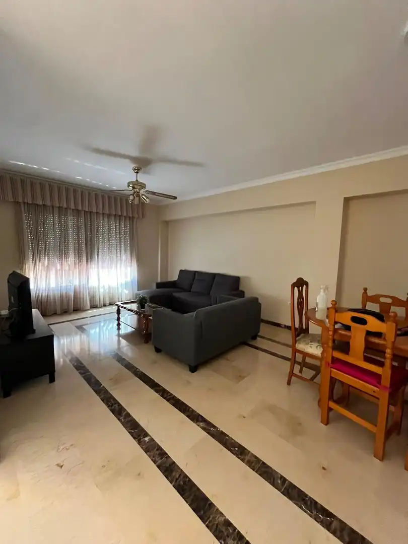 Sala d'estar de Casa adosada de lloguer en Málaga amb Aire condicionat, Terrassa i Moblat