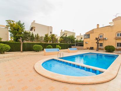 Swimming pool of Single-family semi-detached for sale in Torrevieja  with Air Conditioner, Heating and Terrace