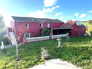 Casa rústica amb piscina en venda a Coín