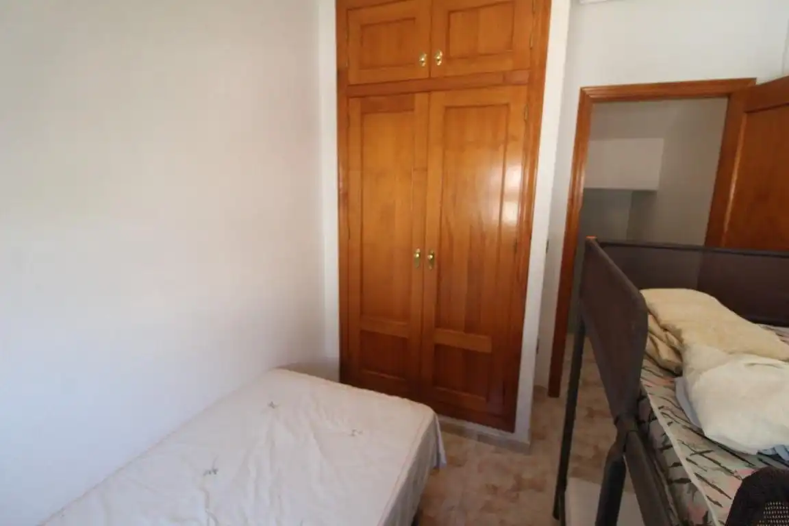 Dormitori de Casa adosada en venda en Orihuela amb Jardí privat, Terrassa i Moblat