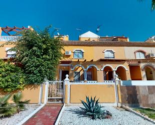 Exterior view of Single-family semi-detached for sale in Los Alcázares  with Air Conditioner, Terrace and Furnished