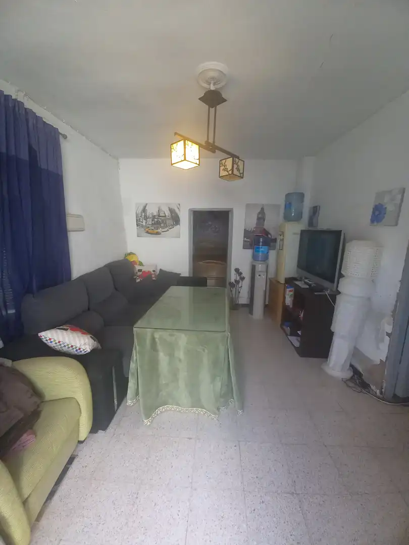 Sala de estar de Casa adosada en venta en Villanueva del Ariscal con Aire acondicionado y Jardín privado