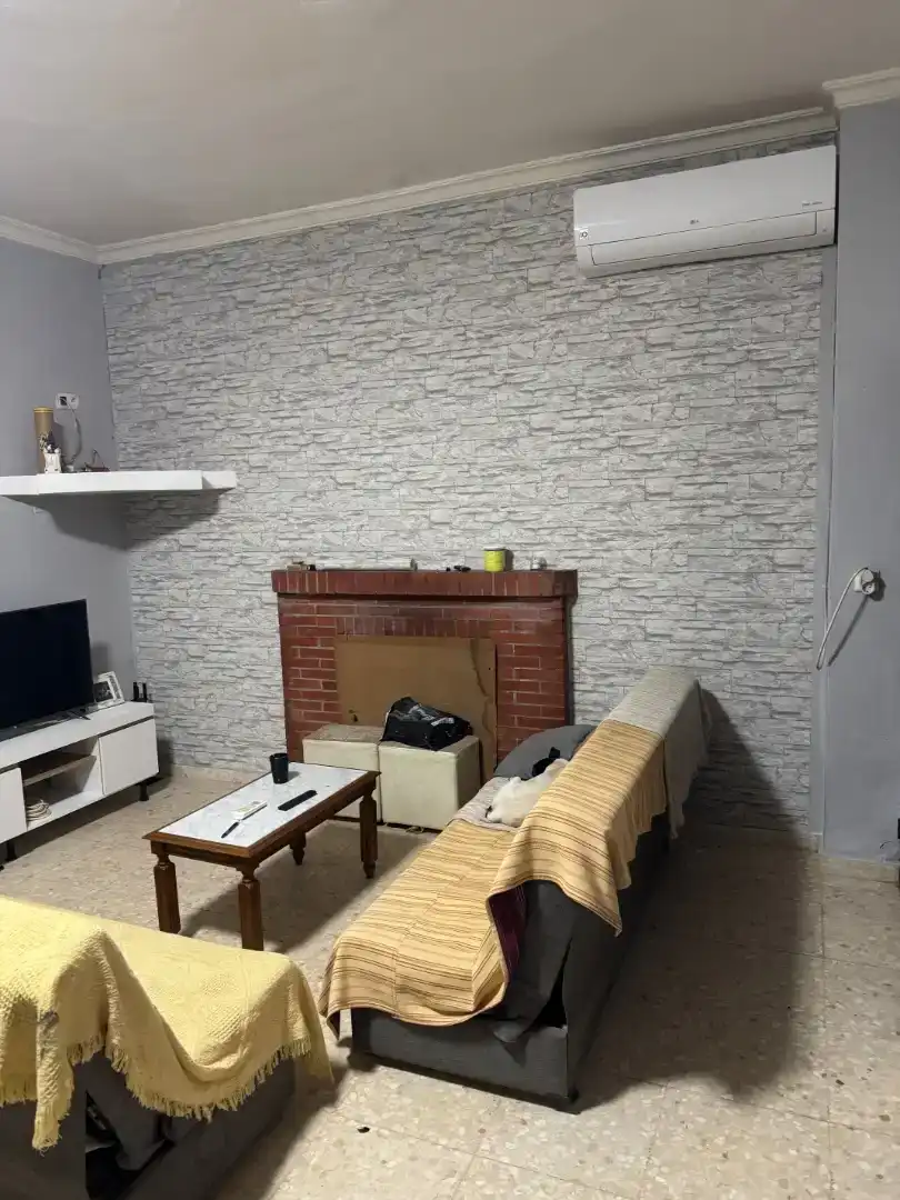 Sala d'estar de Finca rústica en venda en Marchena amb Aire condicionat i Piscina