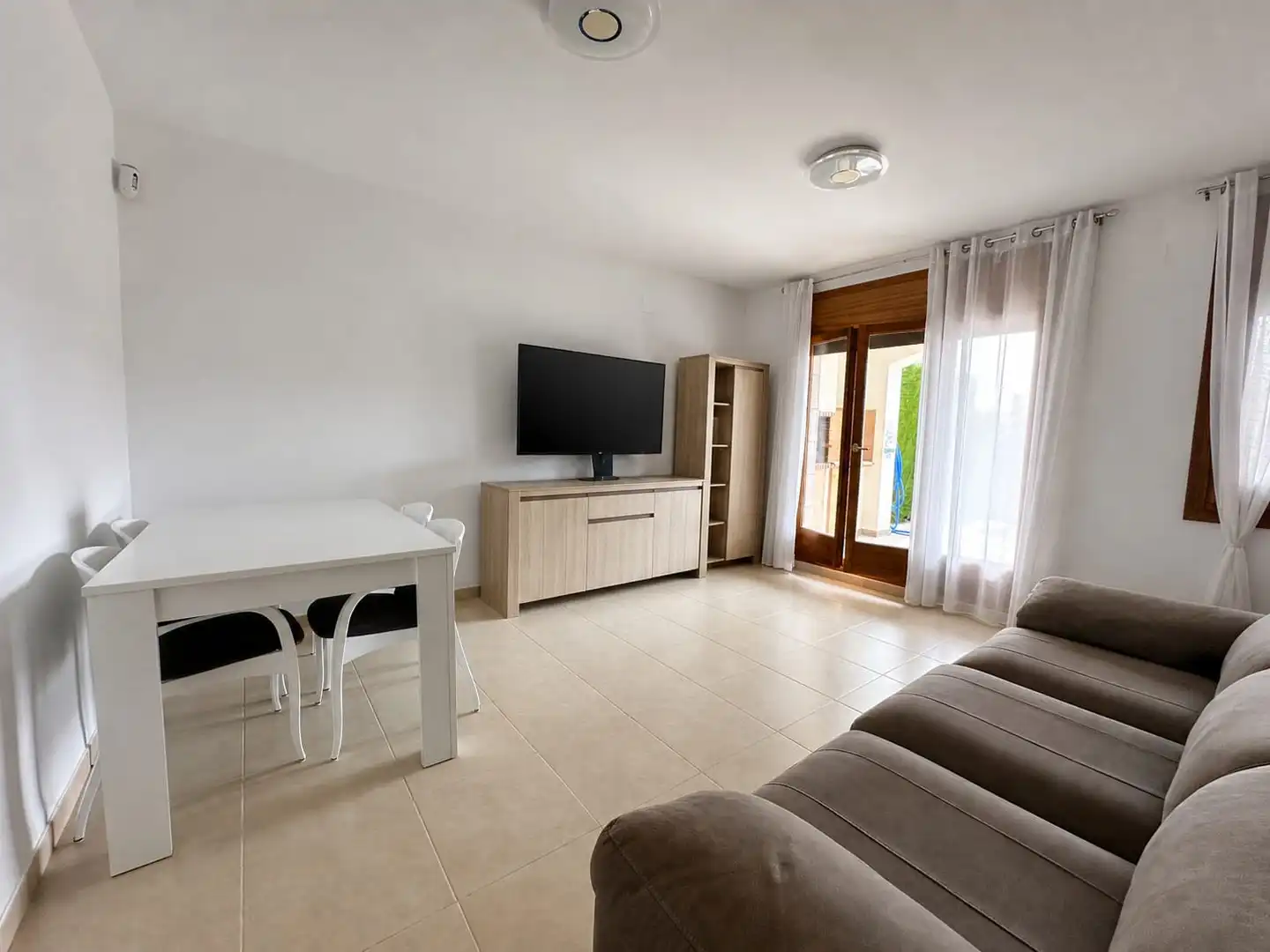 Sala de estar de Casa adosada en venta en Mont-roig del Camp con Aire acondicionado, Jardín privado y Terraza
