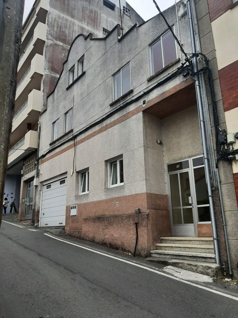 Exterior view of Single-family semi-detached for sale in O Grove    with Private garden, Storage room and Furnished